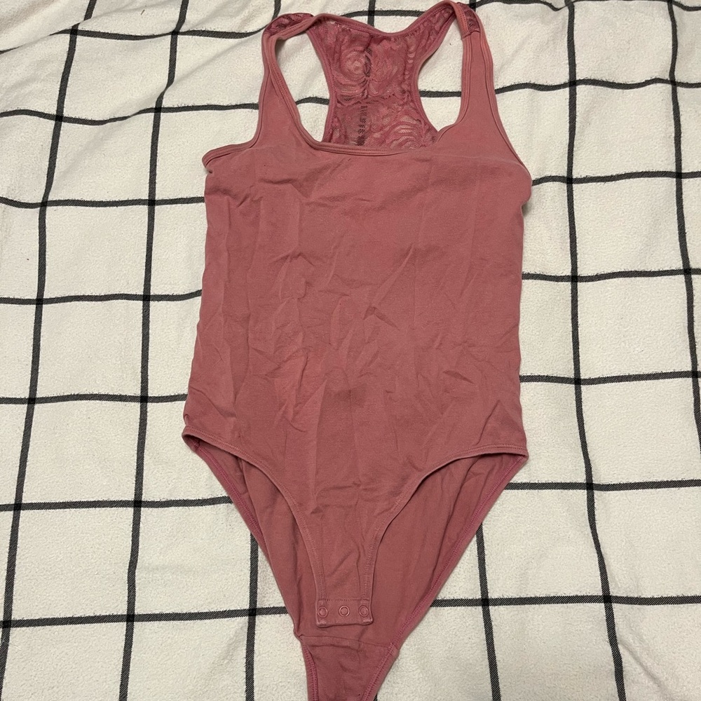 Body suit with lace cut out back